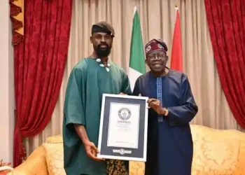 Chess Master Tunde Onakoya Presents His GWR for Longest Chess Marathon to Tinubu in Lagos
